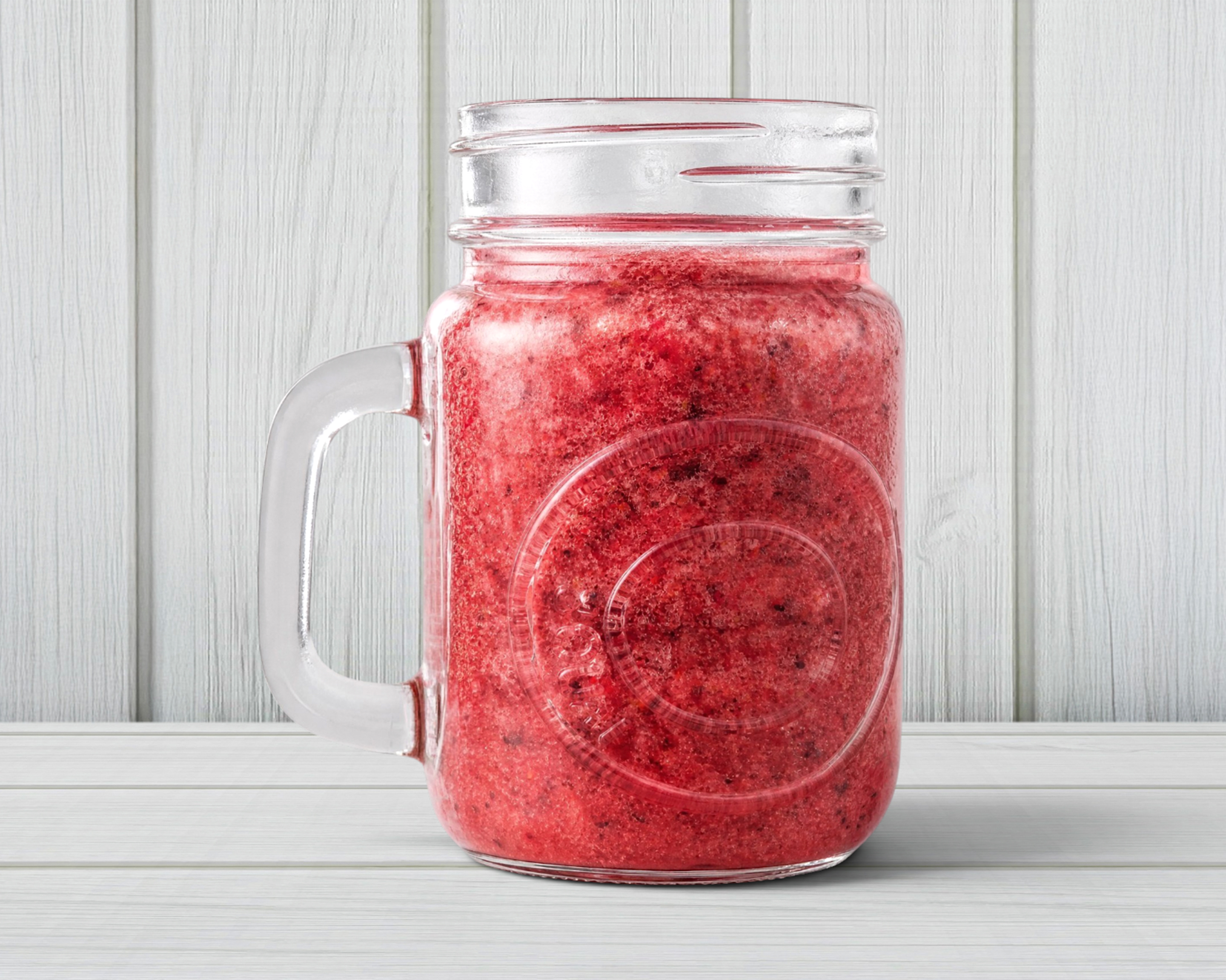 A berry smoothie in a mason jar
